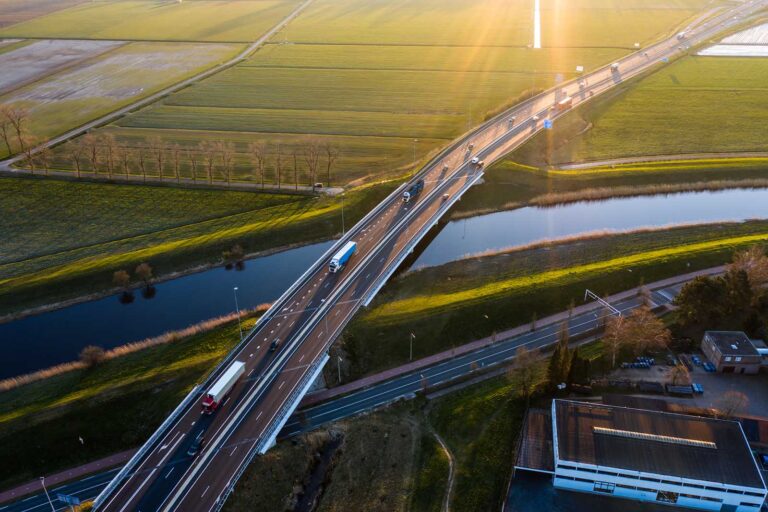 BB Capital - A viaduct bridge crossover a canal of highway a59 during sunrise near waalwijk, noord brabant, netherlands